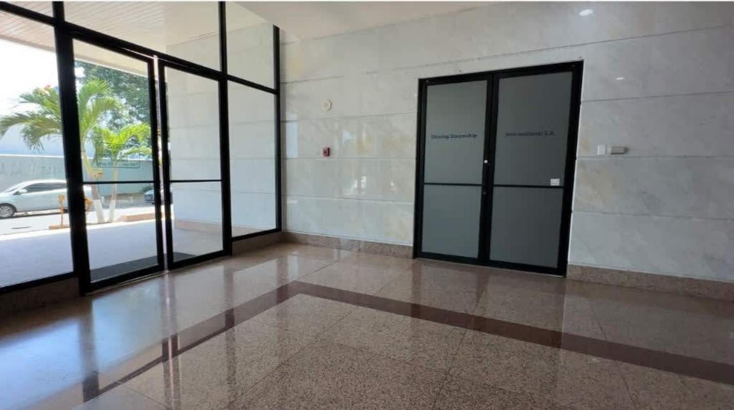 Elegant corporate lobby with granite floors and glass doors in PH Pacific Point Plaza, Coco del Mar Panama City