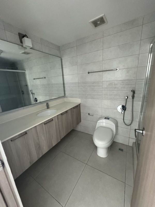 Stylish bathroom with vanity, toilet, mirror and glass shower PH Vivendi Green