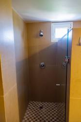 Spacious double-height living room with terrace access canal view PH Eagles Landing