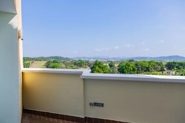 Elegant master bedroom with private balcony and city views Tucan Country Club Panama