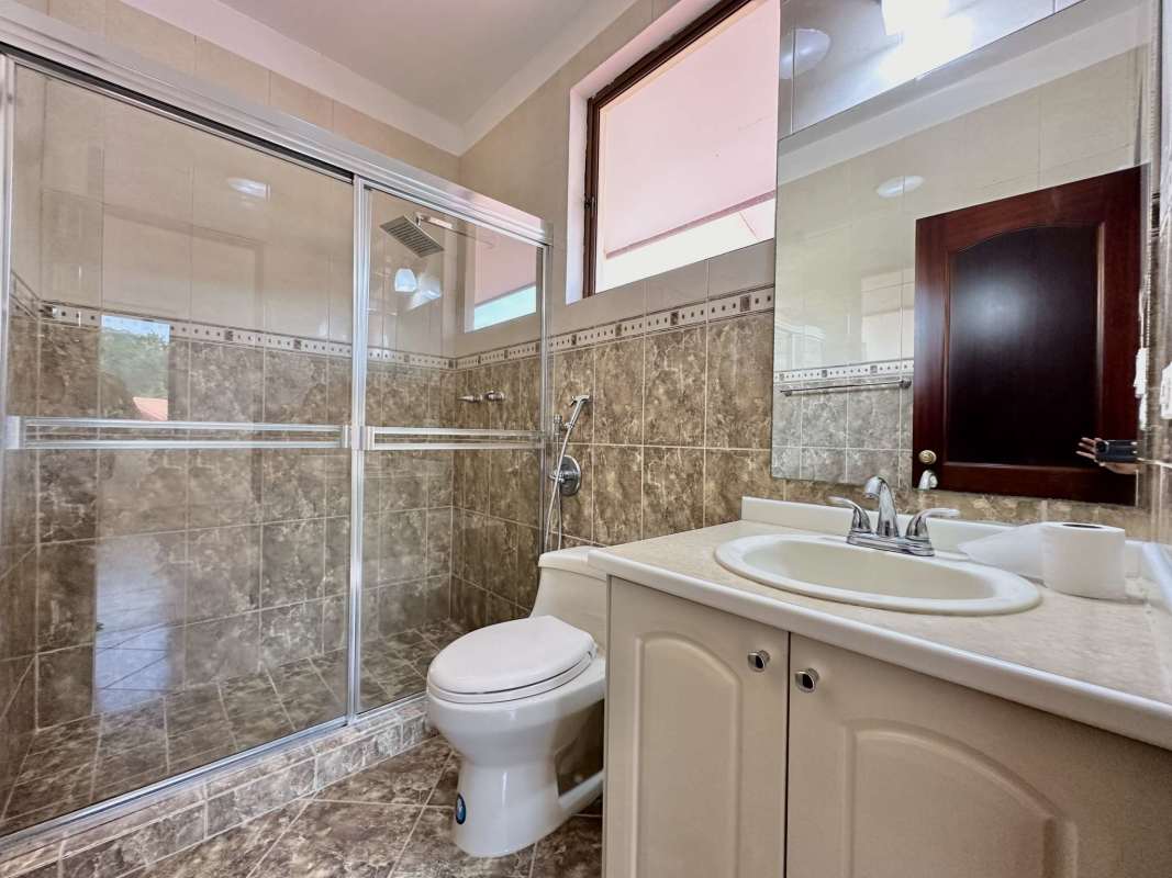 Double height foyer entrance and staircase in luxury home Camino de Cruces Panama City