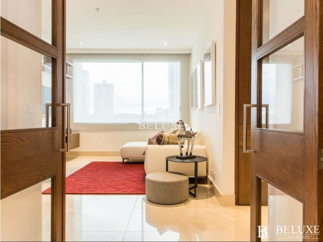 Luxury master bedroom with large windows overlooking ocean in PH Aria Costa del Este Panama