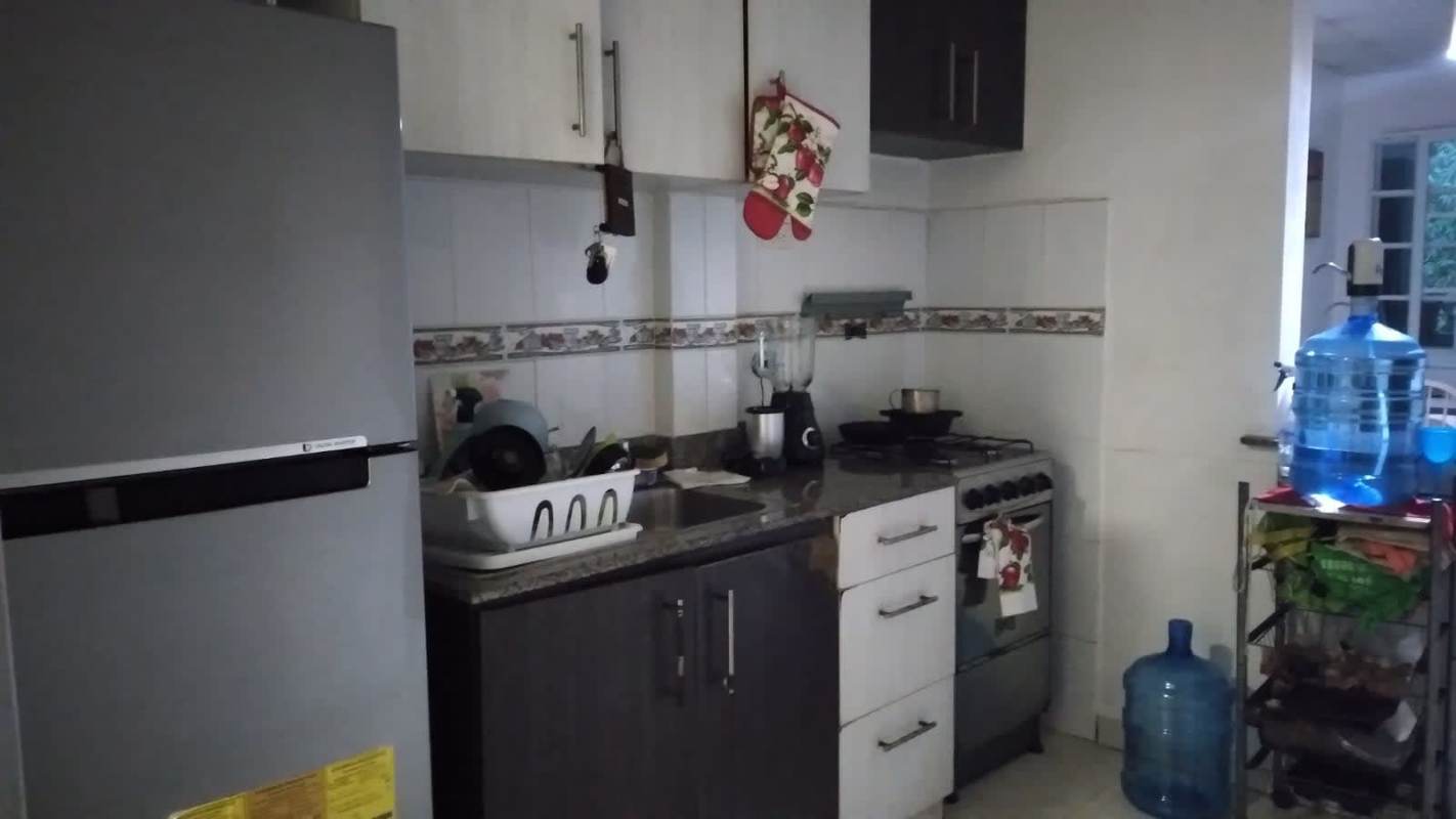 Bathroom with enclosed shower, tile walls and amenities in PH 19th Road apartment