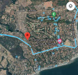 View of paved street and entrance to 800m2 lot in Coronado beachfront community Panama