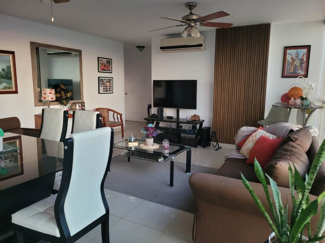 Spacious open-plan living and dining room with tile floors ceiling fan at PH Creta Chanis Panama City