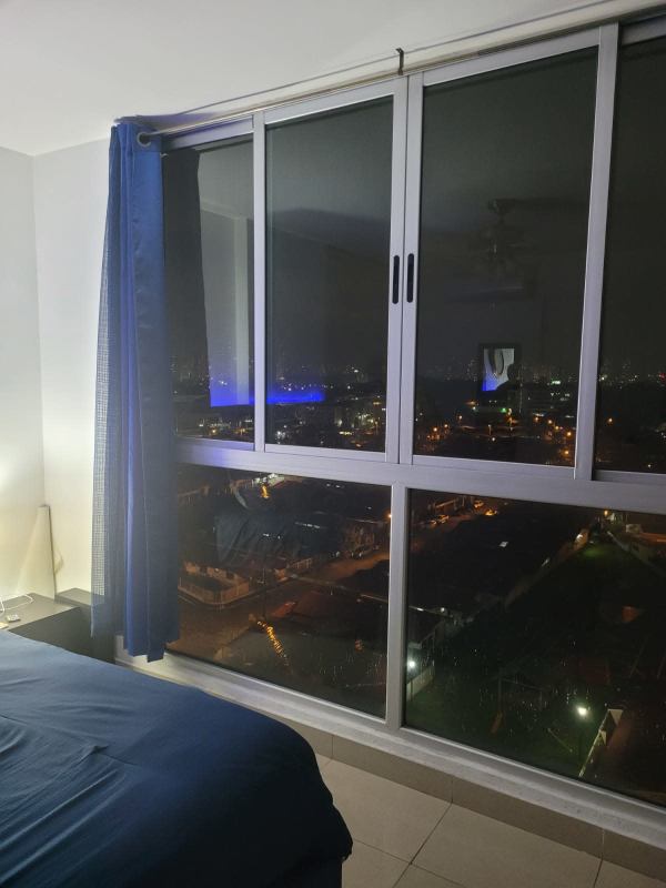 Bedroom with LED headboard large windows city night view PH Creta Chanis Panama