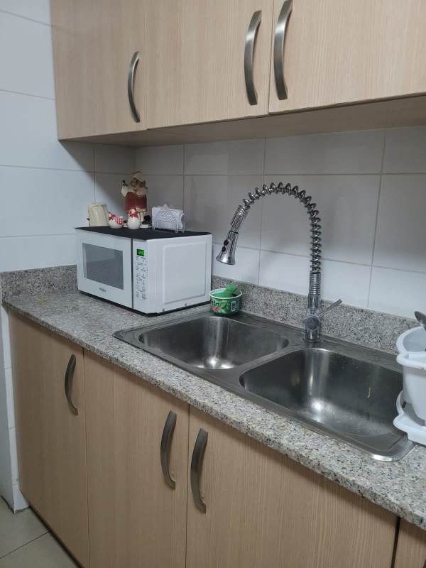 Kitchen with granite counters cabinets tile backsplash PH Creta Chanis Panama City