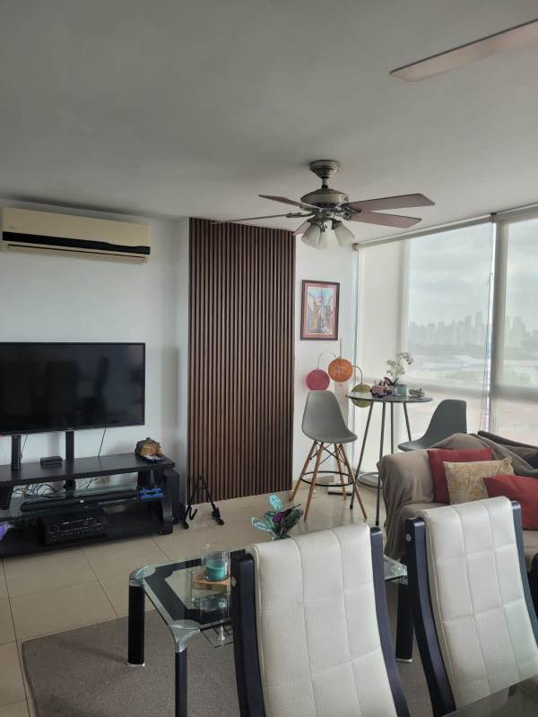 Living room area with panoramic windows city view at PH Creta Chanis Panama City
