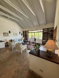 Spacious country estate driveway and landscaped garden with mature tropical trees in El Valle de Antón luxury mountain home