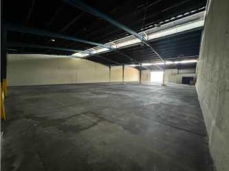 Men's restroom featuring urinals and tiled walls at industrial warehouse Panama