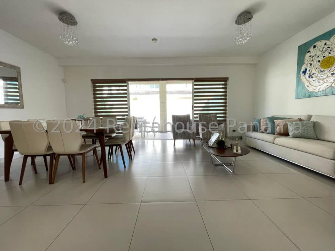 Modern kitchen with granite countertops, stainless appliances, and wood cabinetry in PH Altos del Parque