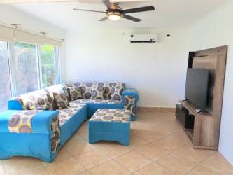 L-shaped kitchen with granite counters, new appliances and large windows in Vista Mar villa San Carlos Panama