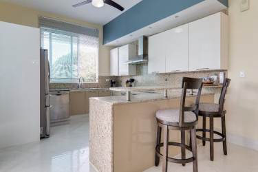 Spacious master bedroom with ocean view balcony at PH Balboa 5 Bijao Panama