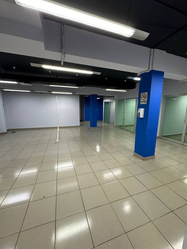 Open office layout with glass walls blue accents in PH BICSA Panama City