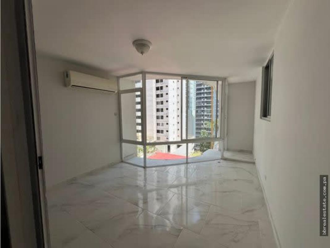 Long kitchen with granite countertops and cabinetry in PH Tamanaco Punta Paitilla Panama