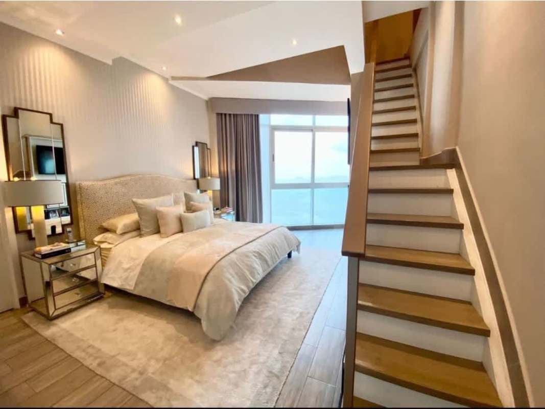 Modern kitchen with granite countertops, stainless steel appliances in PH Pearl at the Sea, Costa del Este Panama