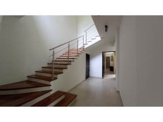 Kitchen with granite countertops stainless appliances and dark cabinetry PH Nativa Panama Pacifico