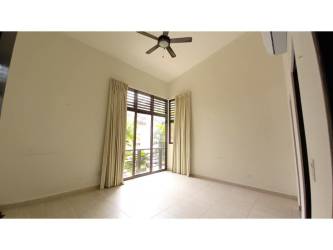 Modern bedroom with large sliding doors tile floor balcony PH Nativa Panama Pacifico