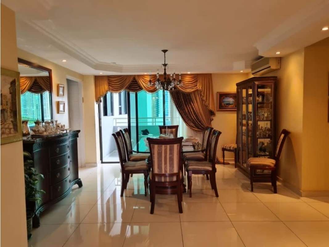 Formal dining space with chandelier and large window Brisas de Marbella Panama