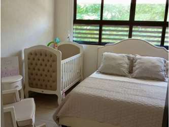 Laundry area with washer dryer hookup and tile floor at PH Nativa house in Panama Pacifico