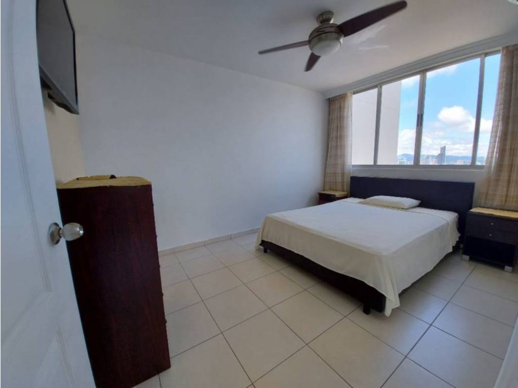 Gym with cardio and weight machines and city view windows at PH Montemar San Francisco Panama City