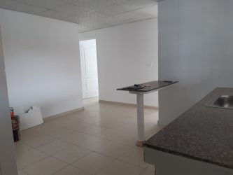 Granite countertop kitchen with white cabinets in affordable Vacamonte house for sale