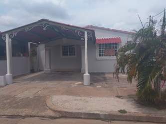 Bathroom with beige ceramic tiles and shower with glass panel in Vacamonte house