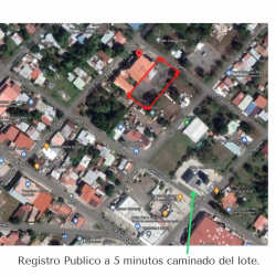 Aerial view highlighting vacant property boundary adjacent to ISAE University and nearby streets in David Chiriquí