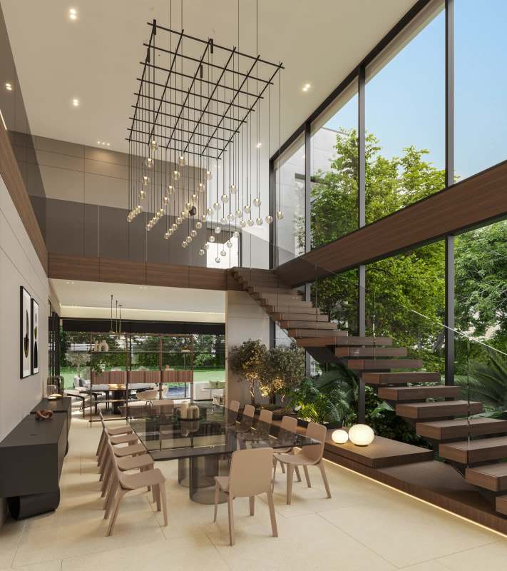 Open double-height living dining space with large windows and floating staircase in Santa Maria mansion Panama