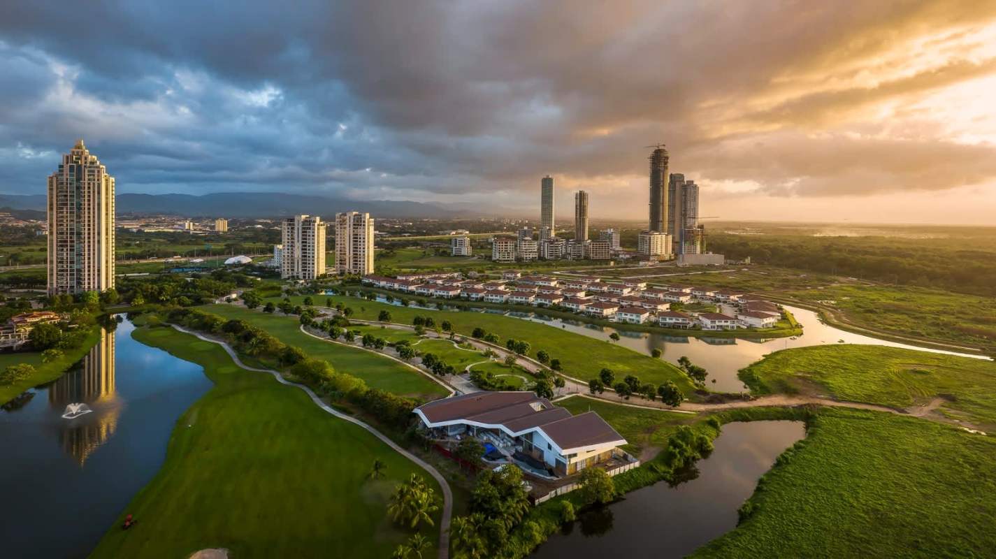 Aerial sunset view luxury towers villas golf course fountain Peninsula Estates Panama City