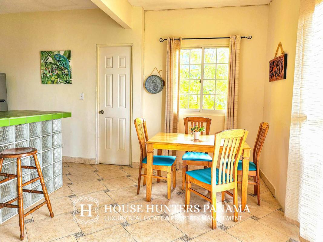 Bright lounge with tropical decor and natural light Isla Taboga boutique hotel Panama