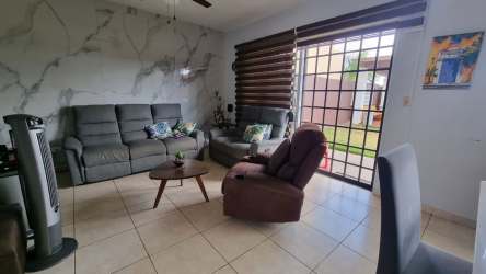 Main bedroom with natural light, balcony and tile floor in home Costa Verde Panama