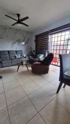 Modern dining space with large window and tile floor in house Costa Verde Panama