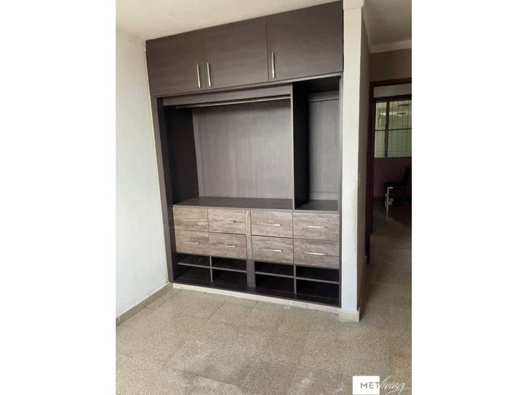 Bedroom with large built-in closet, wood finish and window PH Don David Santa Elena Panama