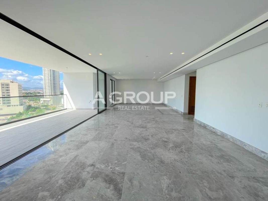 Bright luxury living area with marble floors, floor-to-ceiling windows and panoramic golf and ocean views PH Empire Residences Santa Maria Panama