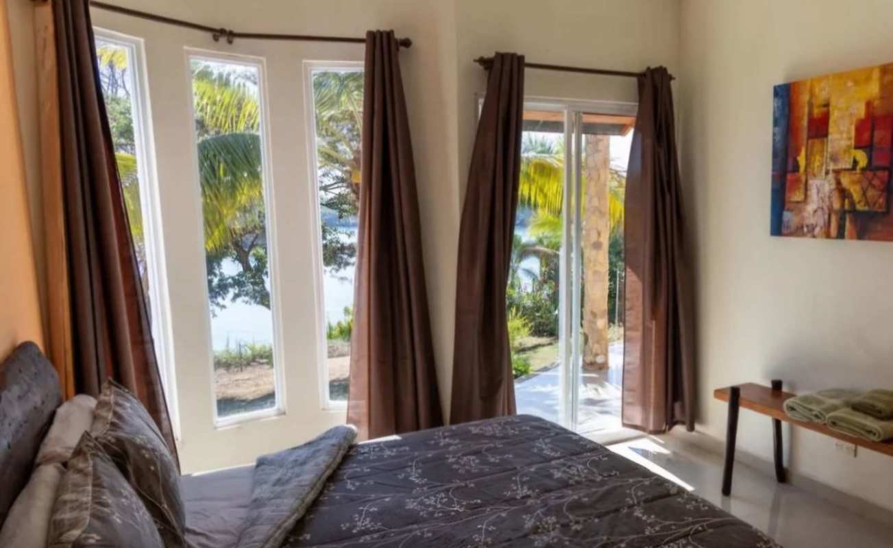 Bedroom window view of beach Isla Saboga Panama