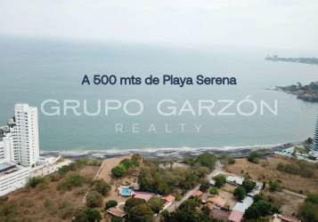 Aerial coastal view of Playa Malibu, ocean, beach houses and swimming pool, Nueva Gorgona Panama