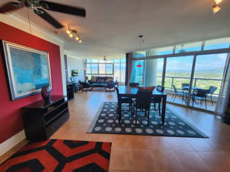 Fully renovated kitchen with granite countertops and stainless steel appliances in Coronado Golf condo