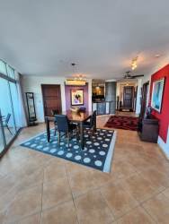 Spacious living and dining area with ocean and golf course views in PH Coronado Golf condo