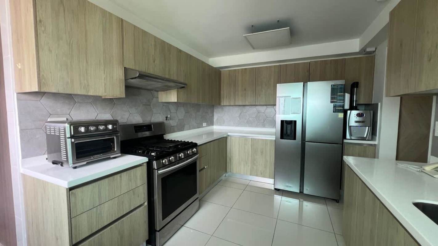 Modern kitchen with wood cabinets white countertops stainless steel PH Forest Gate Albrook
