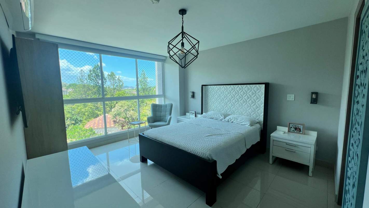 Bedroom with floor to ceiling windows black white decor balcony view PH Forest Gate Panama
