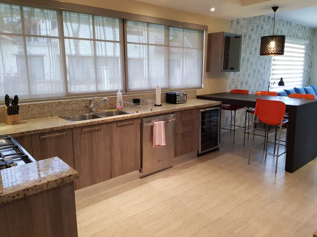 Contemporary kitchen with granite countertops bar stools luxury Panama house