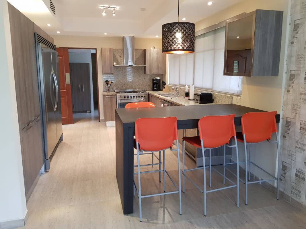 Functional laundry room with appliances cabinets in Senderos de Cruces home Panama City
