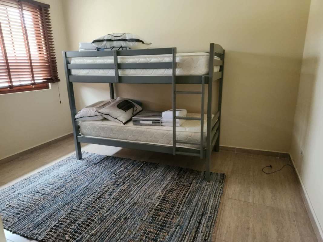 Covered patio lounge dining garden view Senderos de Cruces Panama