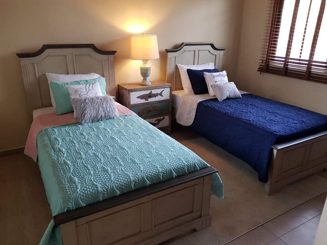 Bedroom with twin beds and nautical decor luxury home Senderos de Cruces Panama