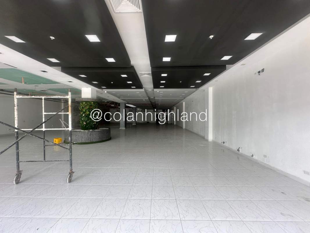 Exterior shopping center with parking lot, storefronts and pedestrian walkways Plaza Costa Sur Panama