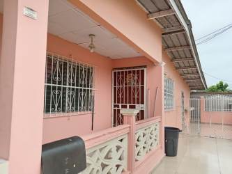Empty bedroom with window grilles tiled floor and pink walls Burunga house