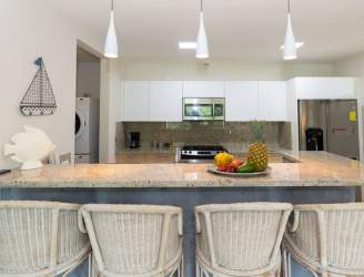 Coastal kitchen with granite counters and breakfast bar Casamar Resort San Carlos Panama