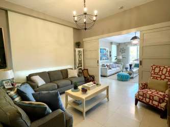 Spacious living room with large windows and contemporary design in Buenaventura Panama villa