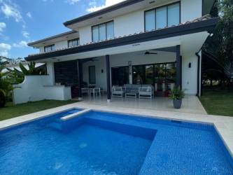 Luxury villa swimming pool with lagoon backdrop in Buenaventura Panama